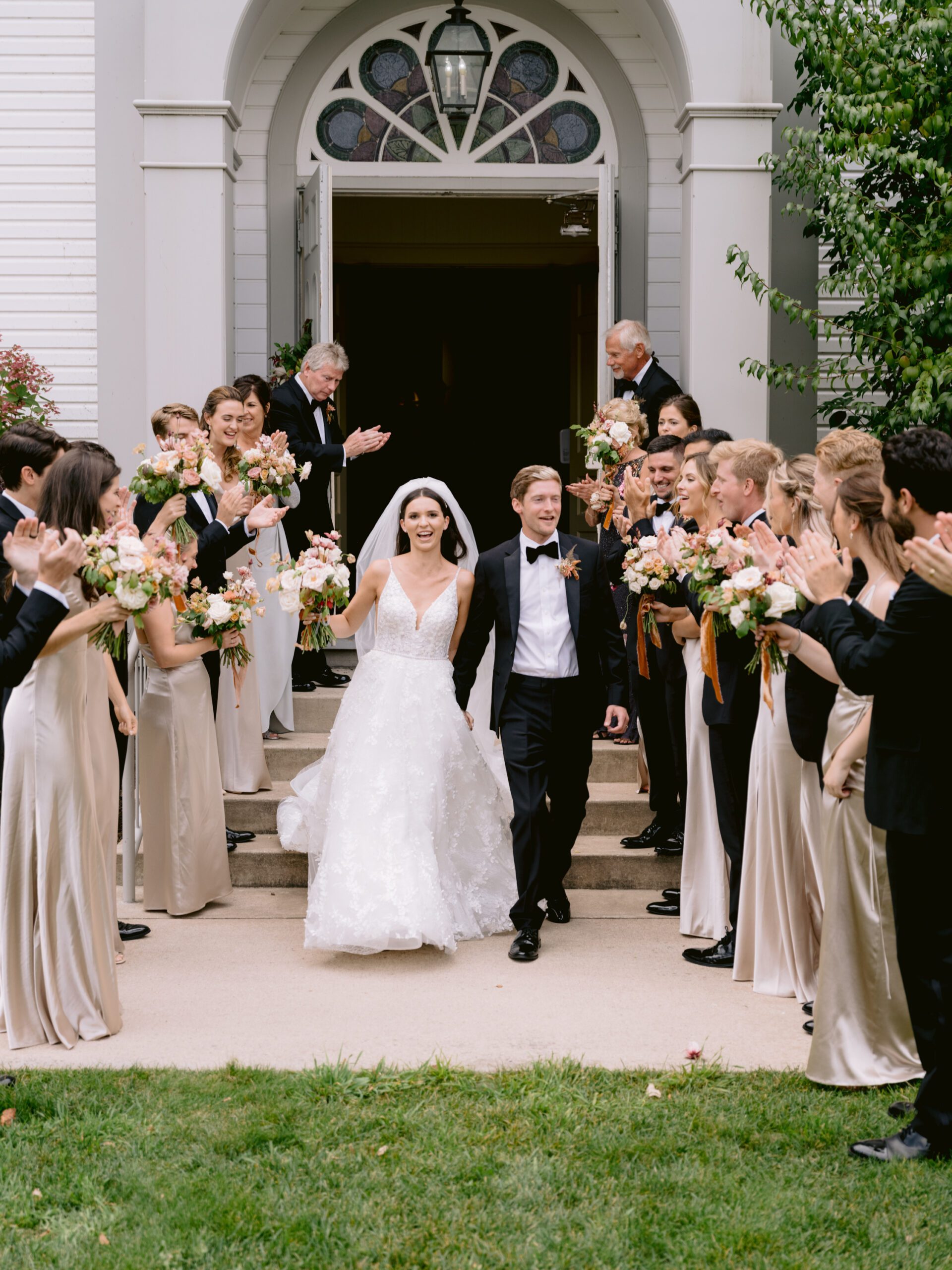 A bride and groom make a grand exit in this wedding photography