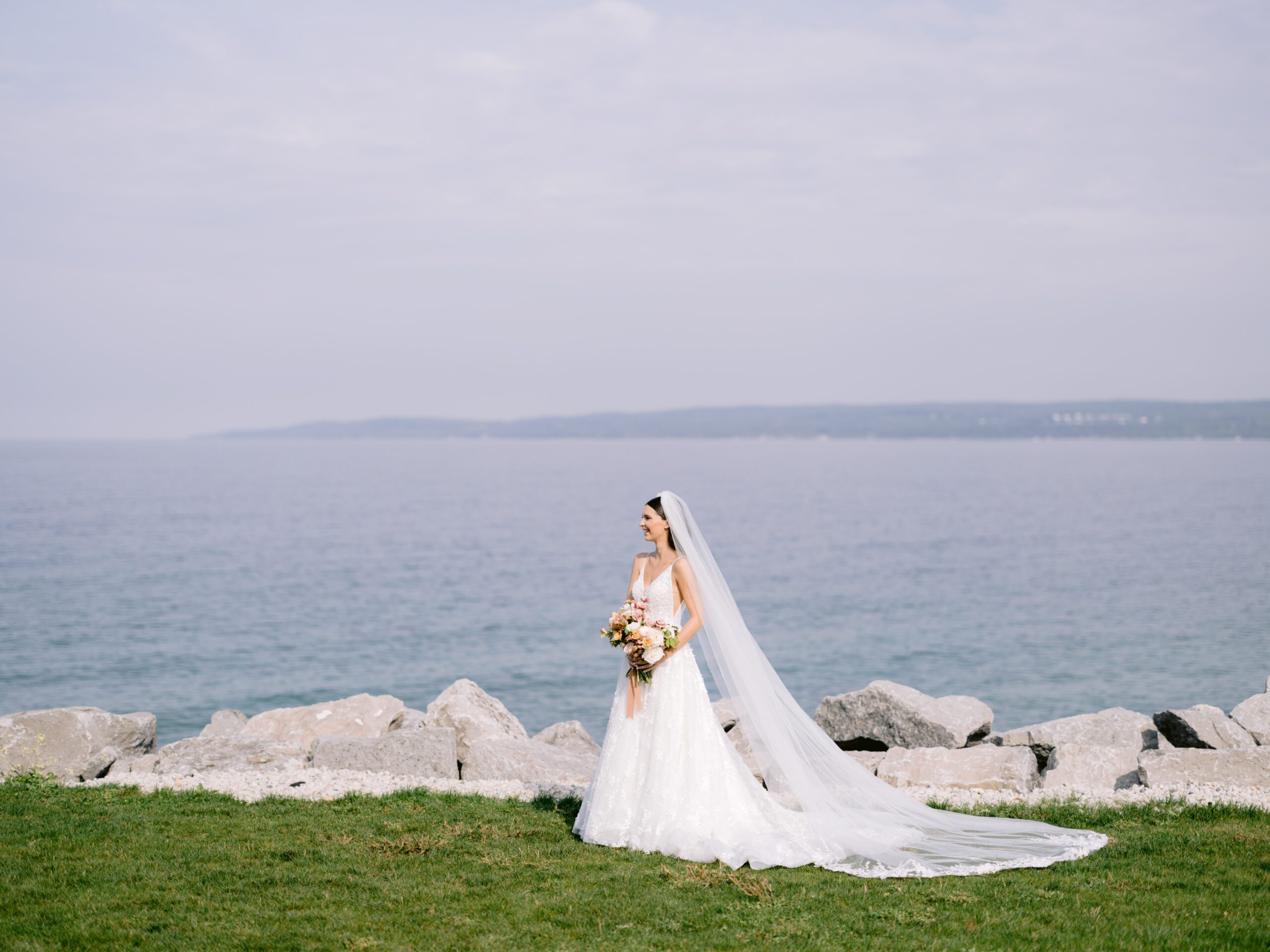 Wide shot of a bride beside lake michigan