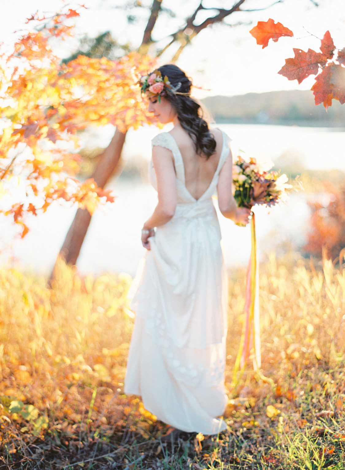 A bride stands holding a bouquet for a Published northern michigan photographer