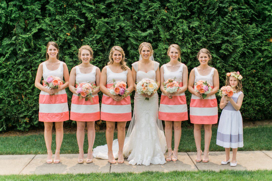 A bride and bridal party pose for photographs in northern michigan