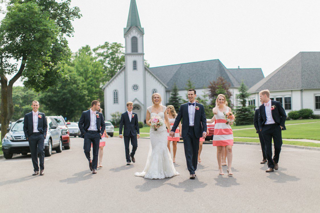 A wedding party pose outside theHoly Childhood in Harbor Springs