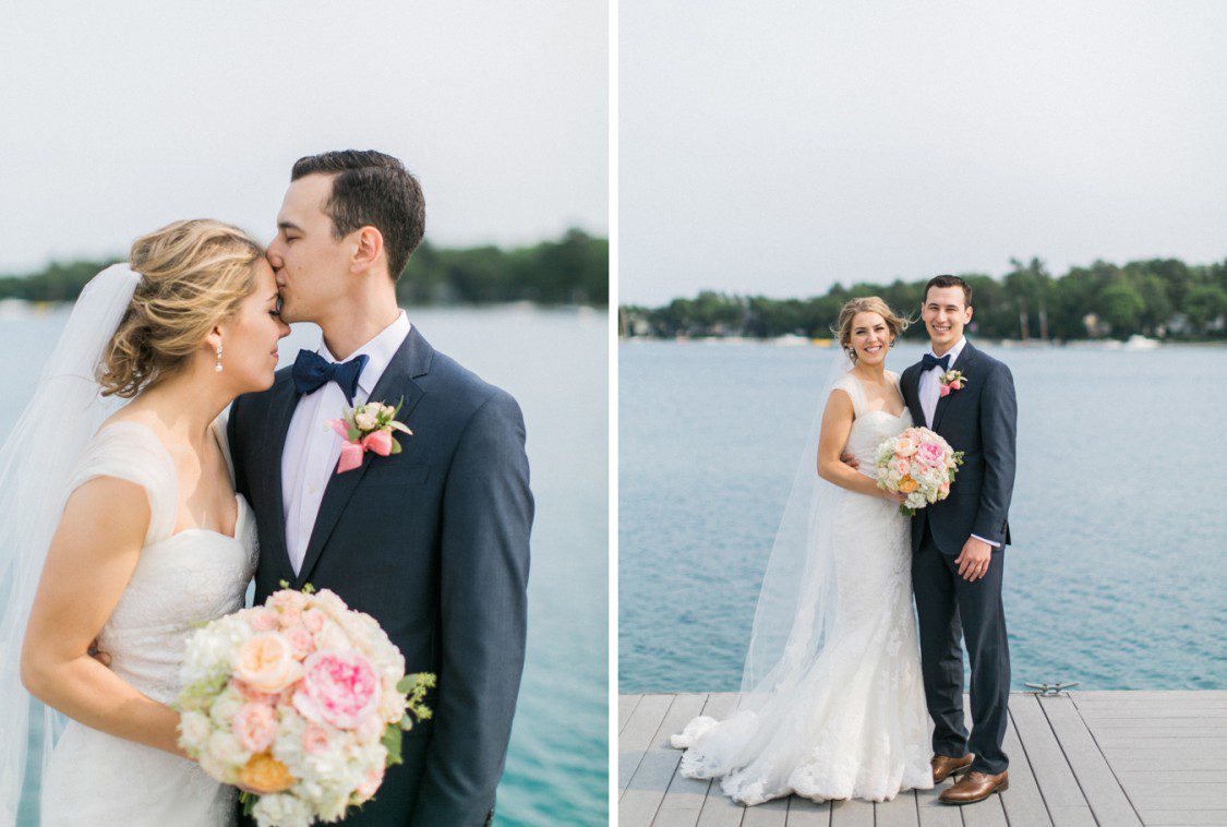 a bride and groom pose beside a michigan lake