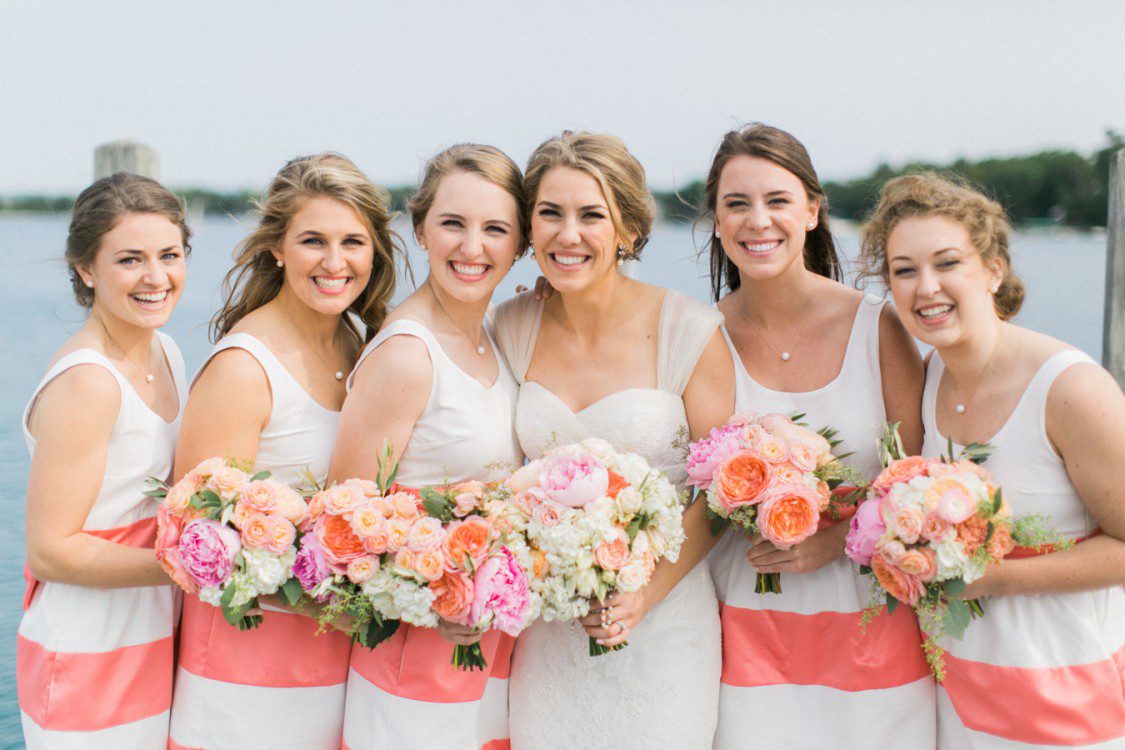Petoskey wedding photographer shoots bridal party with floral Design by BLOOM