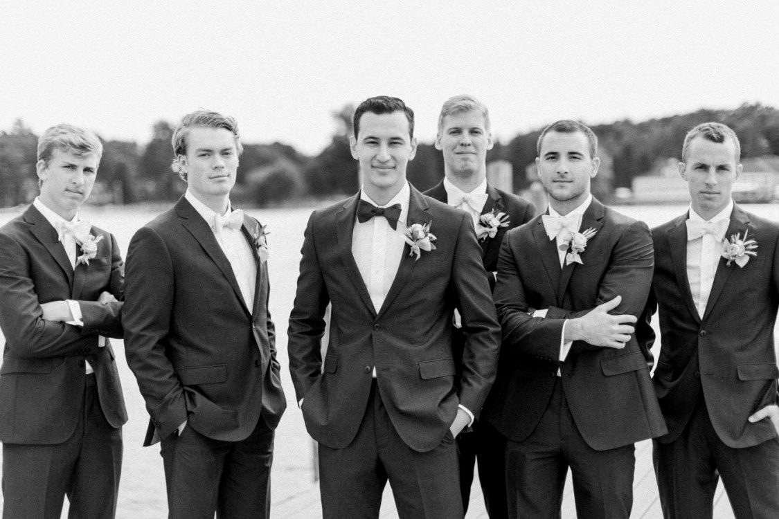 Stylish groomsmen pose for Petoskey wedding photographer