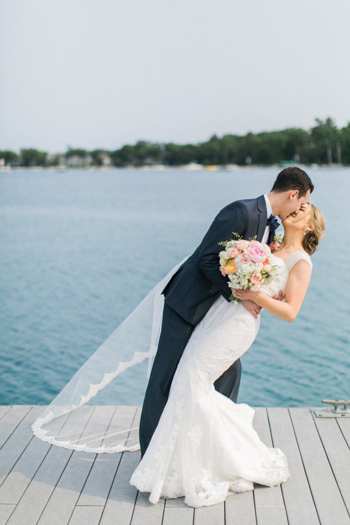 Petoskey wedding photographer snaps bride and groom sharing a romantic moment